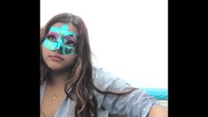 Brunette student takes the questionnaire before going to exams. She touches her breasts in a sexy way.