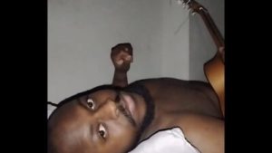 Translating other meanings of horns in the air while singing and playing guitar naked