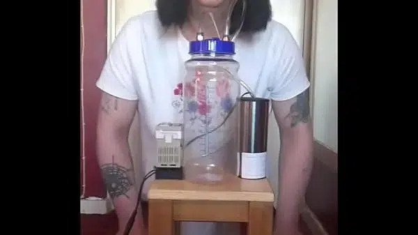 bisexual crossdresser with his portable cow milking machine part 1