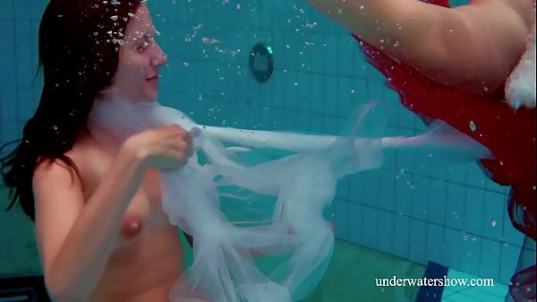 Swimming pool fun with two lesbos